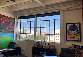 Contemporary commercial office studio with blackout roller shades